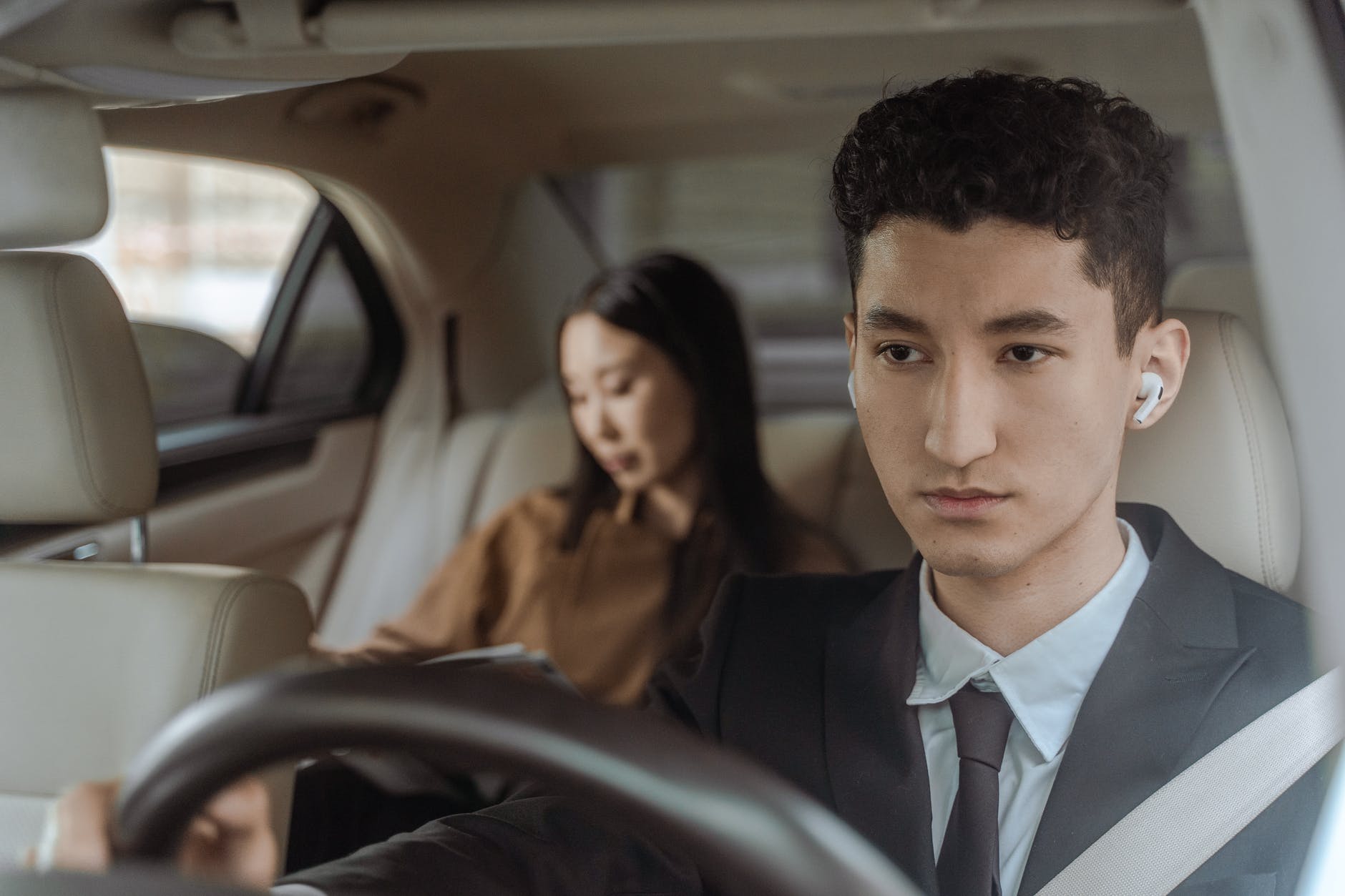 Driver in a tux with Female Passenger